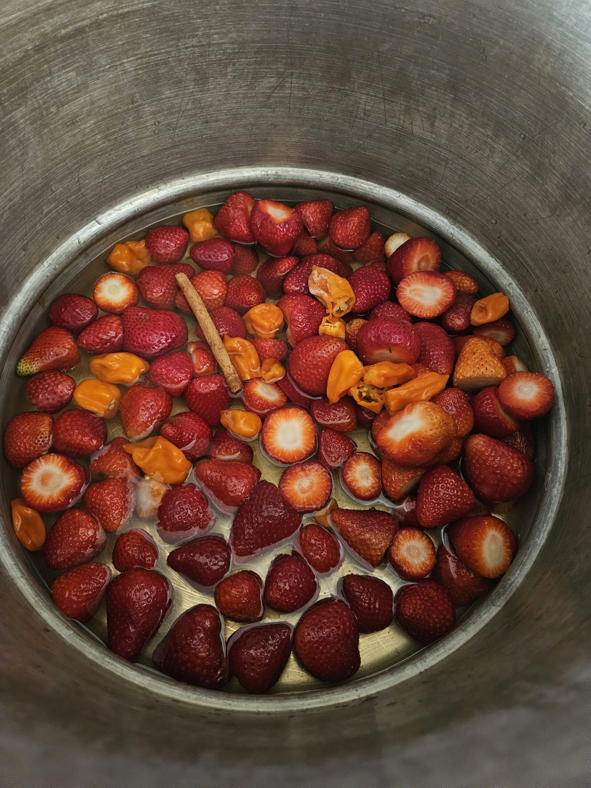 Fresh strawberries and orange peppers prepared for a Three Little Peppers recipe test